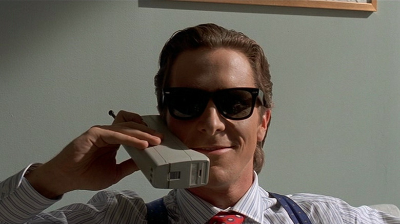 Patrick Bateman talks on the phone in "American Psycho"