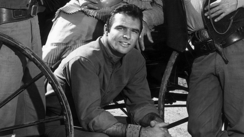 Burt Reynolds posing with his Gunsmoke castmates