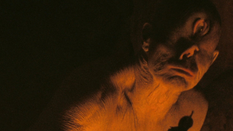 The cyclops in cave surrounded by darkness in Christopher Nolan's The Odyssey