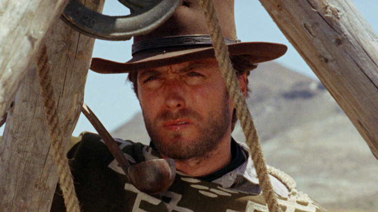 Clint Eastwood drinking water from a ladle as the Man With No Name in A Fistful of Dollars