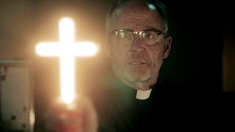 Father Callahan waving a glowing cross in 'Salem's Lot