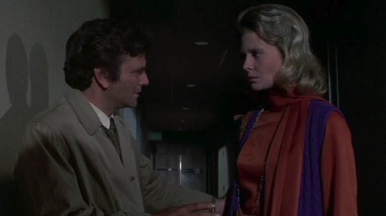 The Columbo Lieutenant assures Joanna Ferris that she will reveal the true cause of the death of her husbands in a dark -lit hallway 