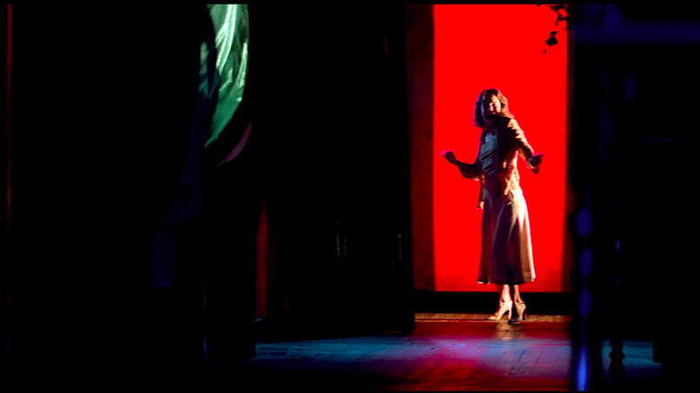 Suzy gets scared at the end of a dark hallway