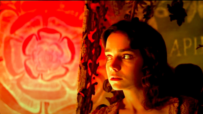Suzy bathed in an ominous yellow light