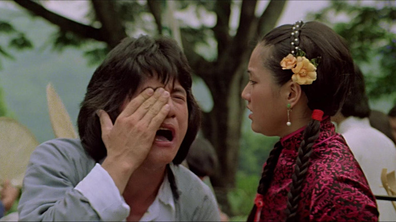 drunken master jackie chan holds face slapped by young woman