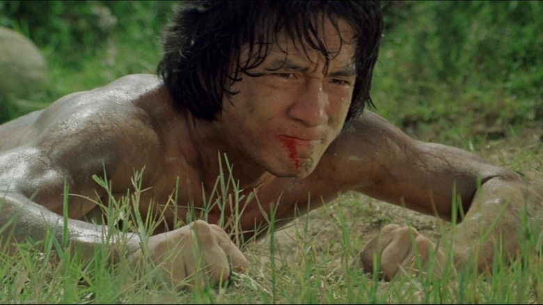drunken master tense jackie chan lies on the ground bleeding from mouth