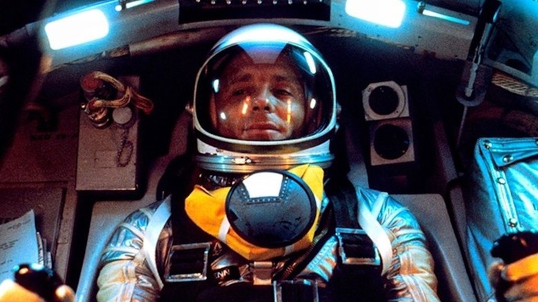 Ed Harris sits in a Mercury capsule as John Glenn in The Right Stuff
