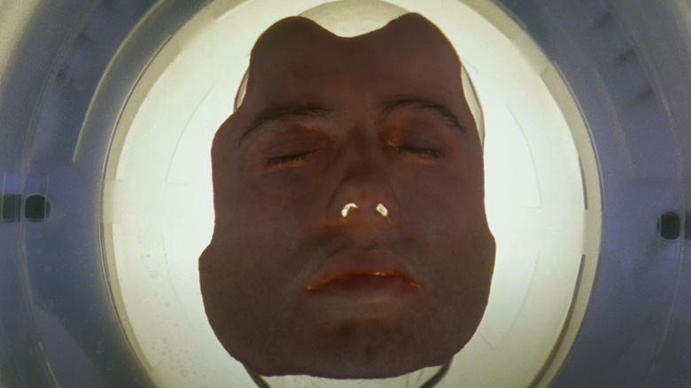 Sean Archer's (John Travolta) detached face sits in a medical receptacle in Face/Off