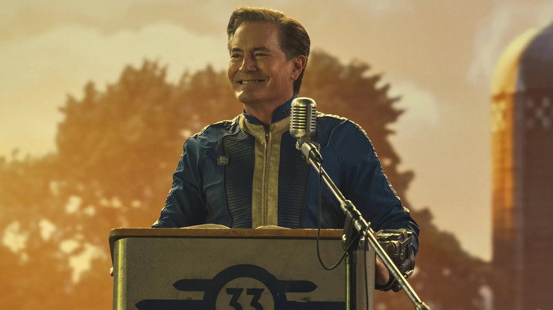 Hank MacLean smiling in front of a microphone in Fallout