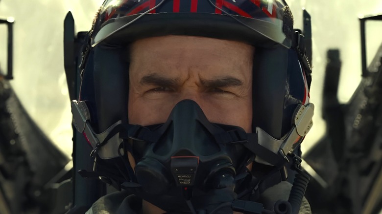 A close up of Tom Cruise's Maverick wearing naval aviator gear in Top Gun: Maverick