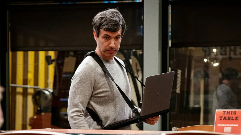 Nathan Fielder watching two people in The Rehearsal 