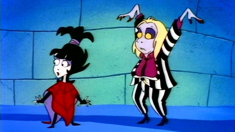 Lydia walking away from Beetlejuive, his arms raised, in Beetlejuice