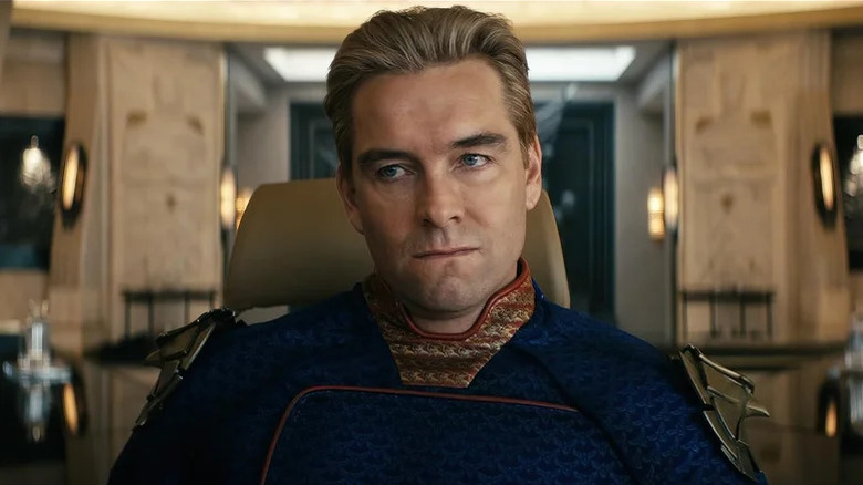 Antony Starr's Homelander looking serious and sitting on a chair on The Boys