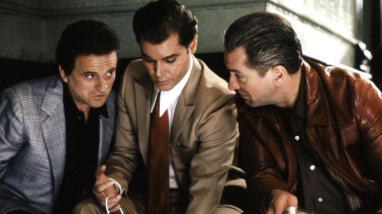 Three men in suits meeting