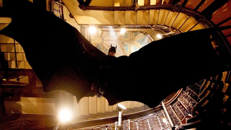 Christian Bale as Batman open wings