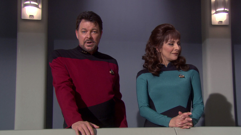 Riker and Troim wacthing over the holographic recreation of the "Star Trek: Enterprise" finale.
