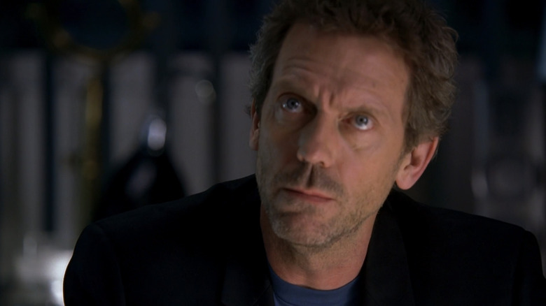 Hugh Lori while the house looks up from its desk in the house