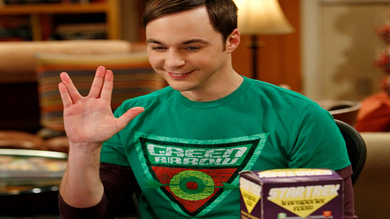 Sheldon doing the Klingon Salute and smiling on The Big Bang Theory