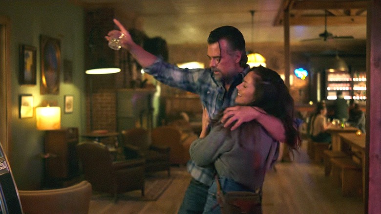 Josh Duhamel's Staten Kirkland and Minka Kelly's Quinn O'Grady hold each other in a bar in Ransom Canyon