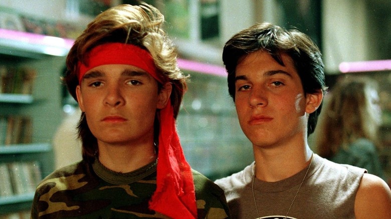 The Frog Brothers standing next to each other in "The Lost Boys"