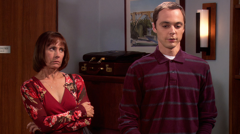 Mary standing behind Sheldon disapprovingly on The Big Bang Theory