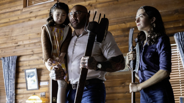 Kristen Cui, Dave Bautista, and Abby Quinn in Knock at the Cabin