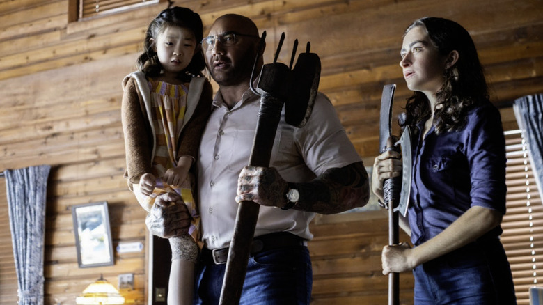 Kristen Cui, Dave Bautista, and Abby Quinn in Knock at the Cabin