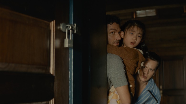 Ben Aldridge, Kristen Cui, and Jonathan Groff in Knock at the Cabin