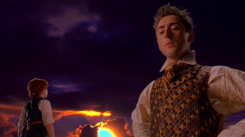 spy kids giant floop stands against sunset with juni