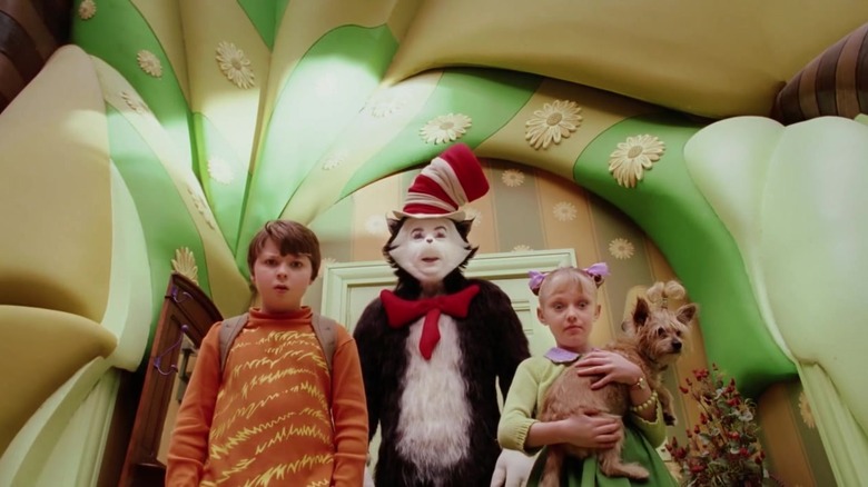 the cat in the hat cat and children with dog walk through warped house