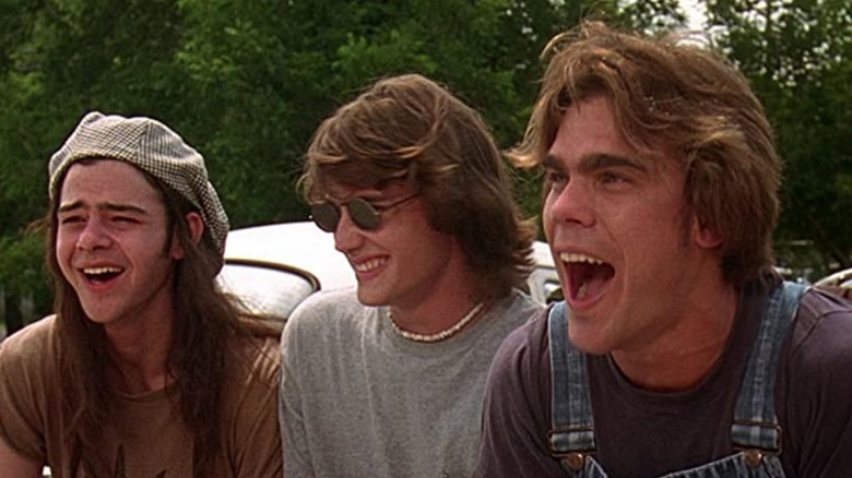 Dazed and Confused three guys sitting on car