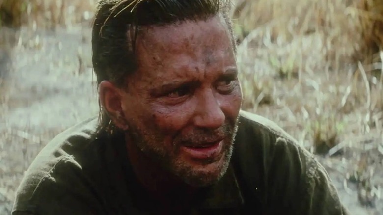 Mickey Rourke weeps as an unnamed scout sniper in The Thin Red Line