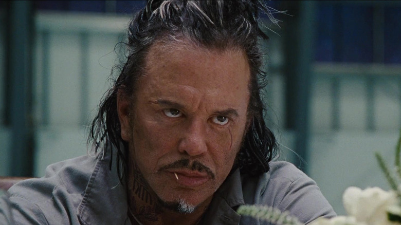Whiplash glaring with a toothpick in his mouth in Iron Man 2