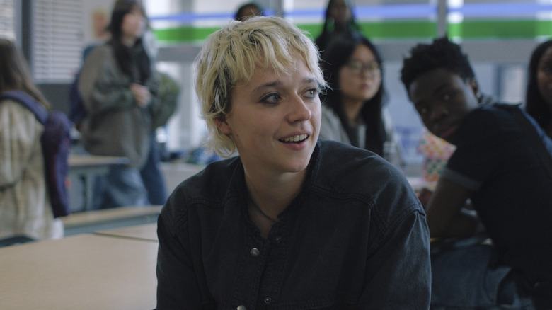 Emaline smiling in class in Carrie (2026)