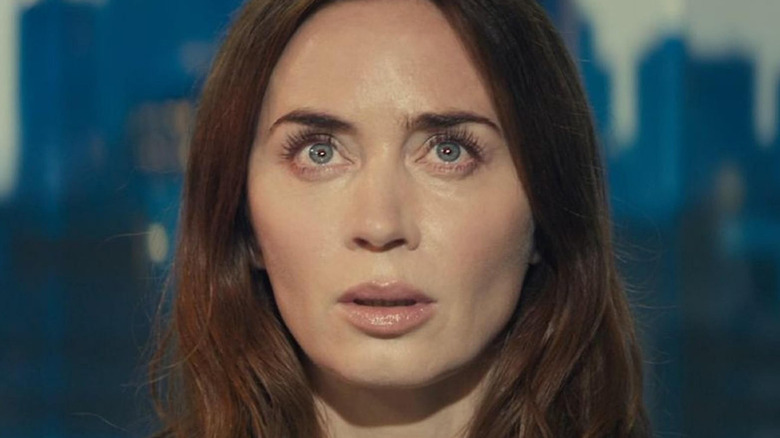 Emily Blunt as Margaret stares up at a glowing light in Disclosure Day