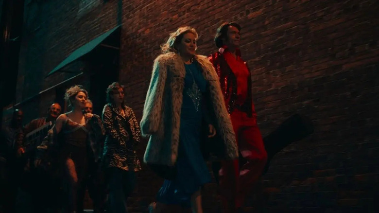 Claire, Mike, and their entourage head to a gig in Song Sung Blue