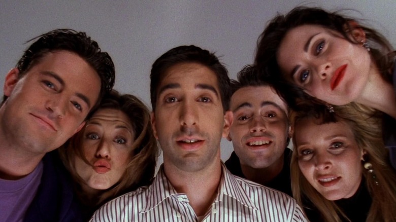 David Schwimmer's Ross Geller and the rest of Friends are looking down and smiling