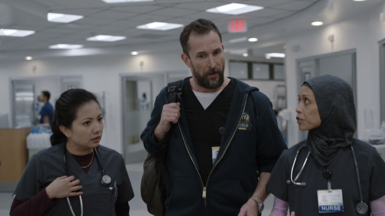 Noah Wyle's Dr. Michael Robinavitch walks through the ER alongside Amielynn Abellera's Perlah Alawiin and Kristin Villanueva's Princess Dela Cruz in The Pitt