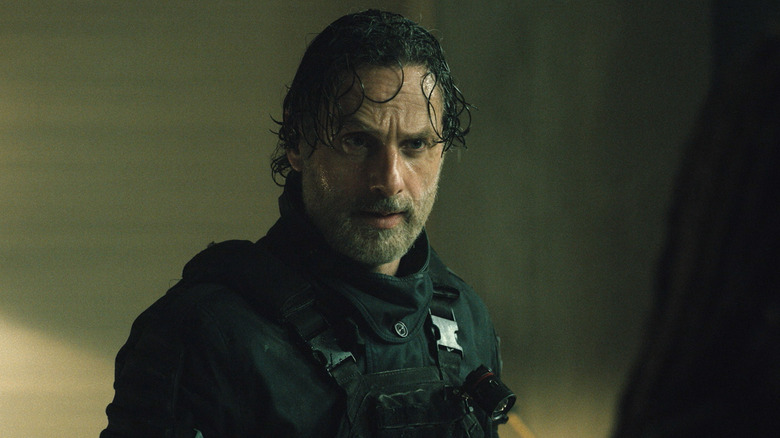 Andrew Lincoln as Rick Grimes sweaty in his riot gear in The Walking Dead: The Ones Who Live