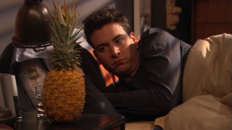 Ted Mosby wakes up in his apartment, right next to a pineapple in How I Met Your Mother