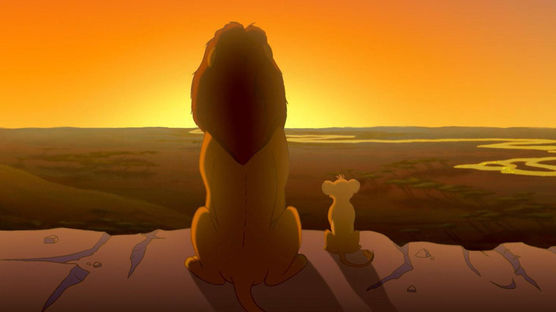Simba and Mufasa look out over the sunset on the Pride Lands in The Lion King