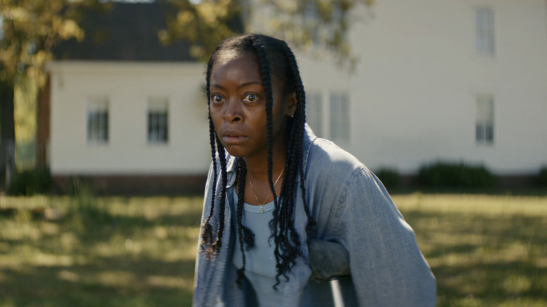 Danielle Deadwyler's Romana approaching the mysterious woman in The Woman in the Yard