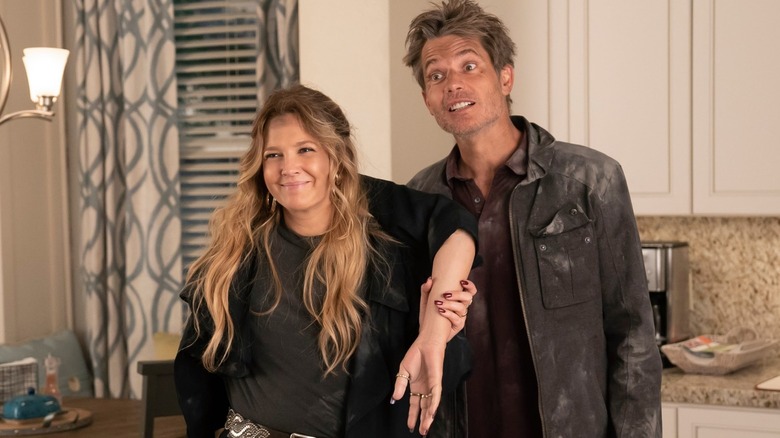 Sheila and Joel covered in dirt in Santa Clarita Diet