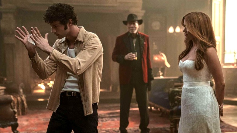 Bosco and Henley doing a magic trick with the diamond in Now You See Me: Now You Don't