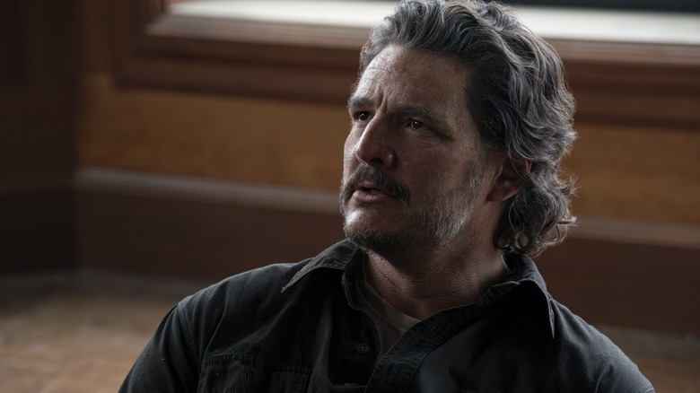 Joel looking up at Abby on The Last of Us