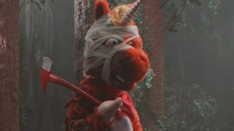 Buddy the Unicorn with his arms out holding an ax in Buddy