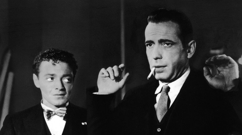 Humphrey Bogart is held up by Peter Lorre
