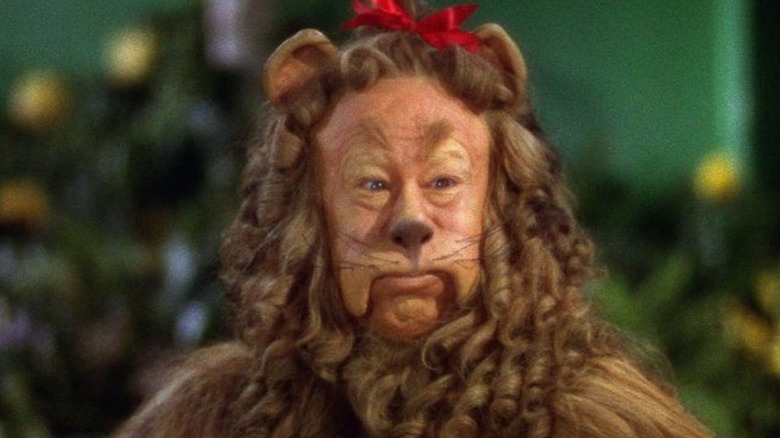 The Cowardly Lion wearing a bow in his hair in The Wizard of Oz