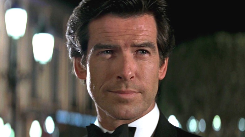 Pierce Brosnan's James Bond smiles while wearing a tuxedo in GoldenEye