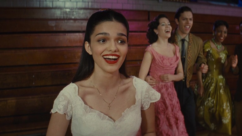 Maria smiling at a school dance in West Side Story (2021)